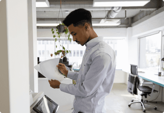 a man holding a piece of paper