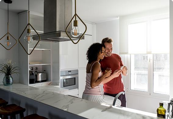 a man and woman in a kitchen