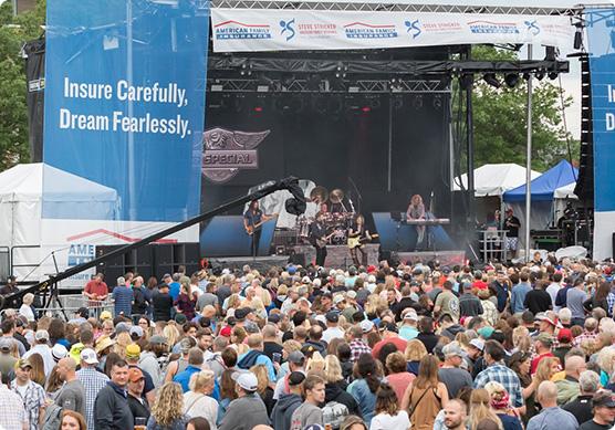 a group of people watching a band on stage