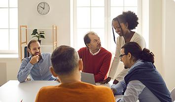 a group of people sitting around a table