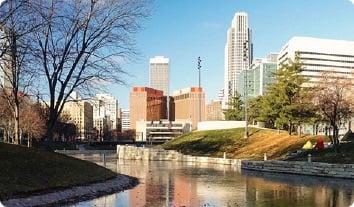 a body of water with buildings in the background