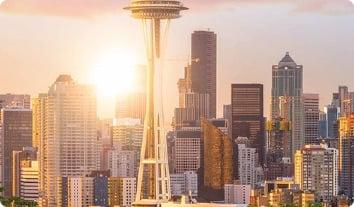 a city skyline with a tall tower