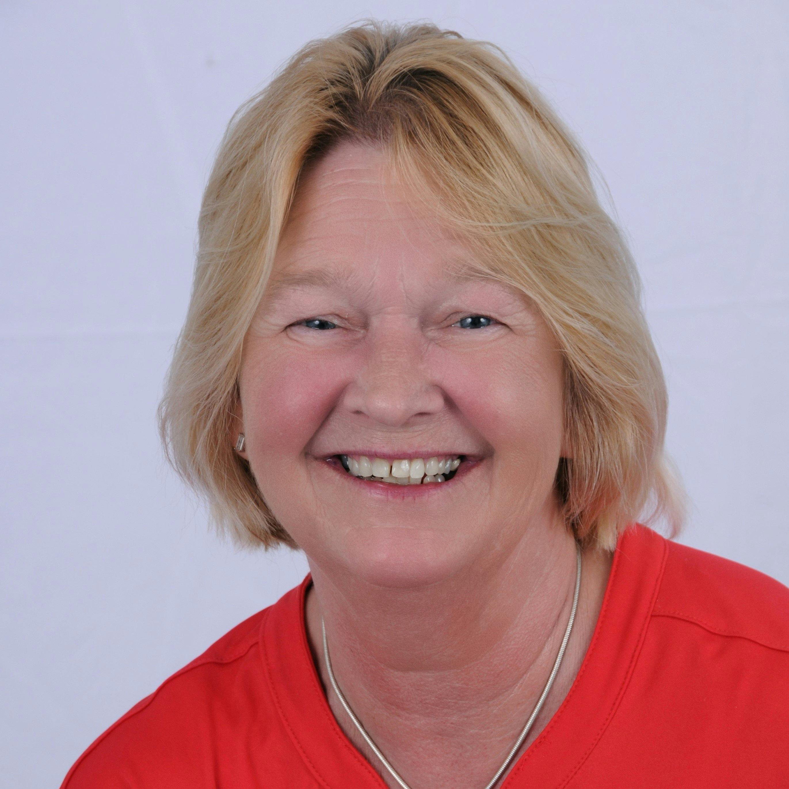 a woman wearing a red shirt