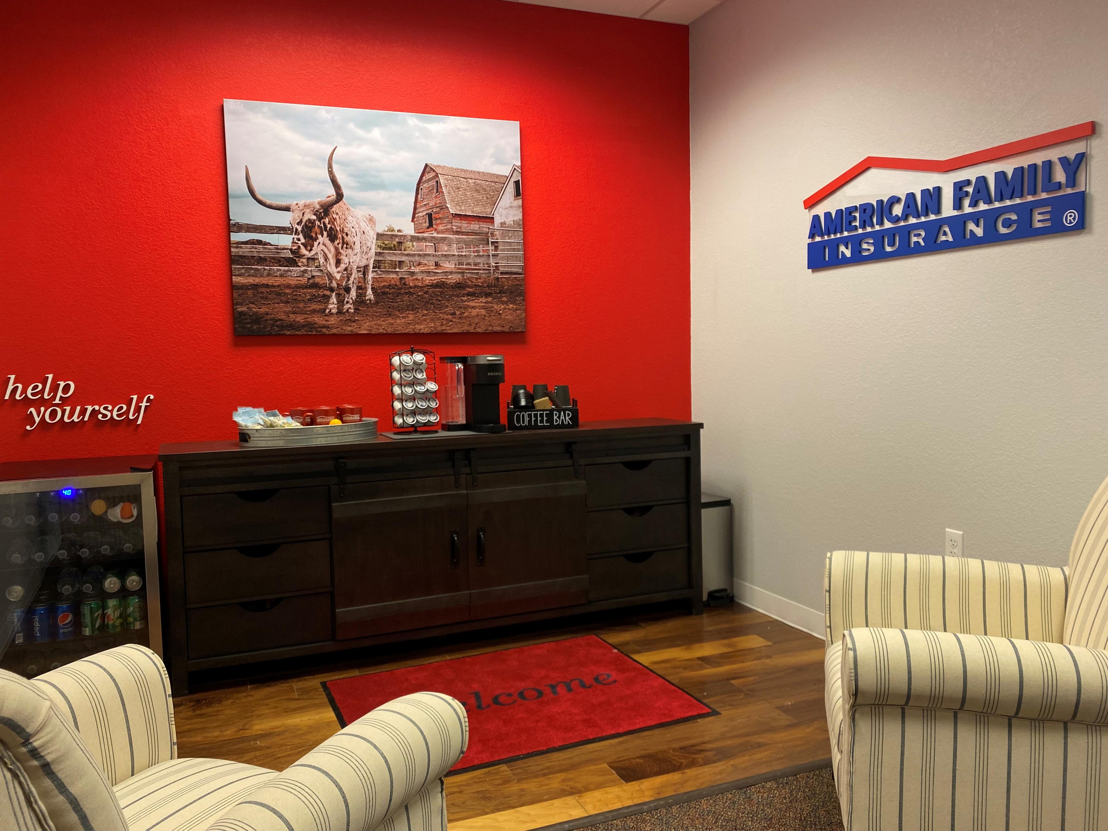 a room with a red wall and a white couch