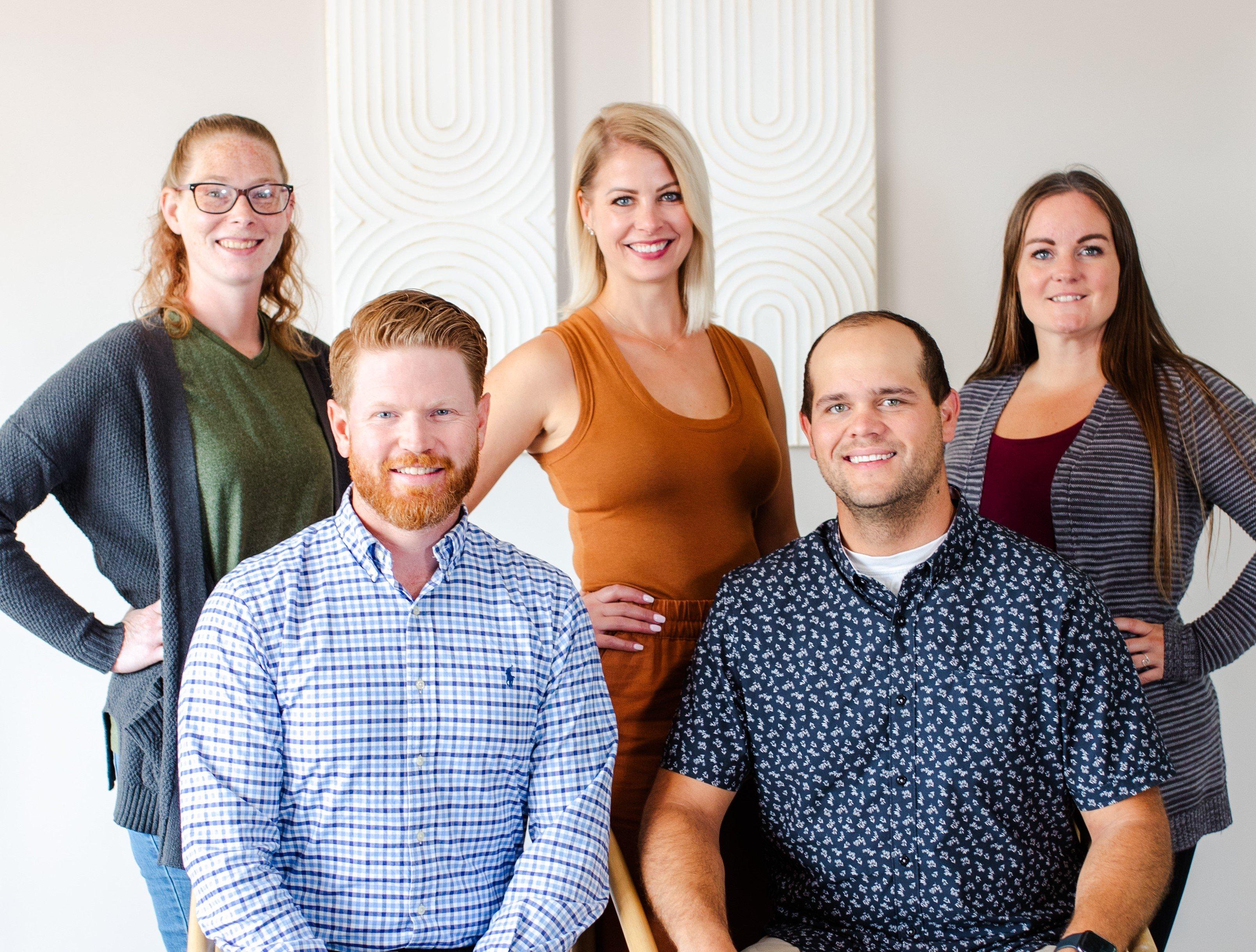 a group of people posing for a photo