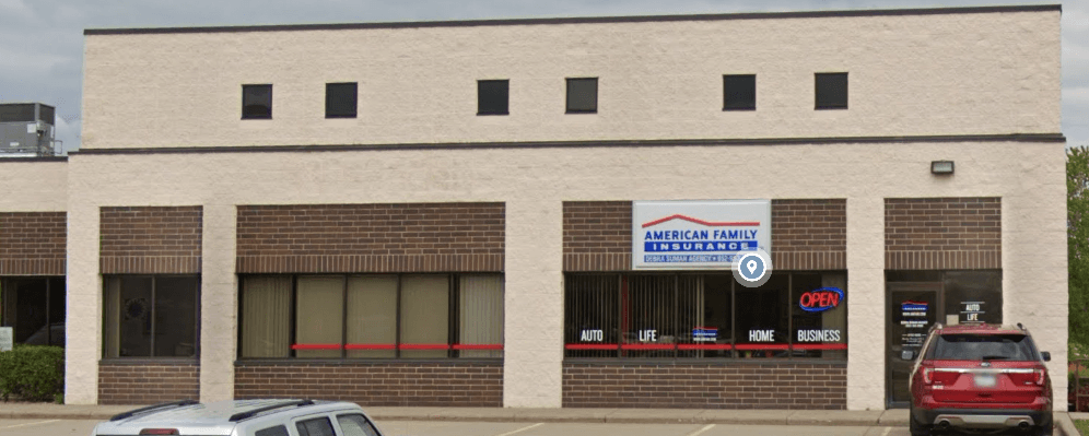 a building with cars parked in front