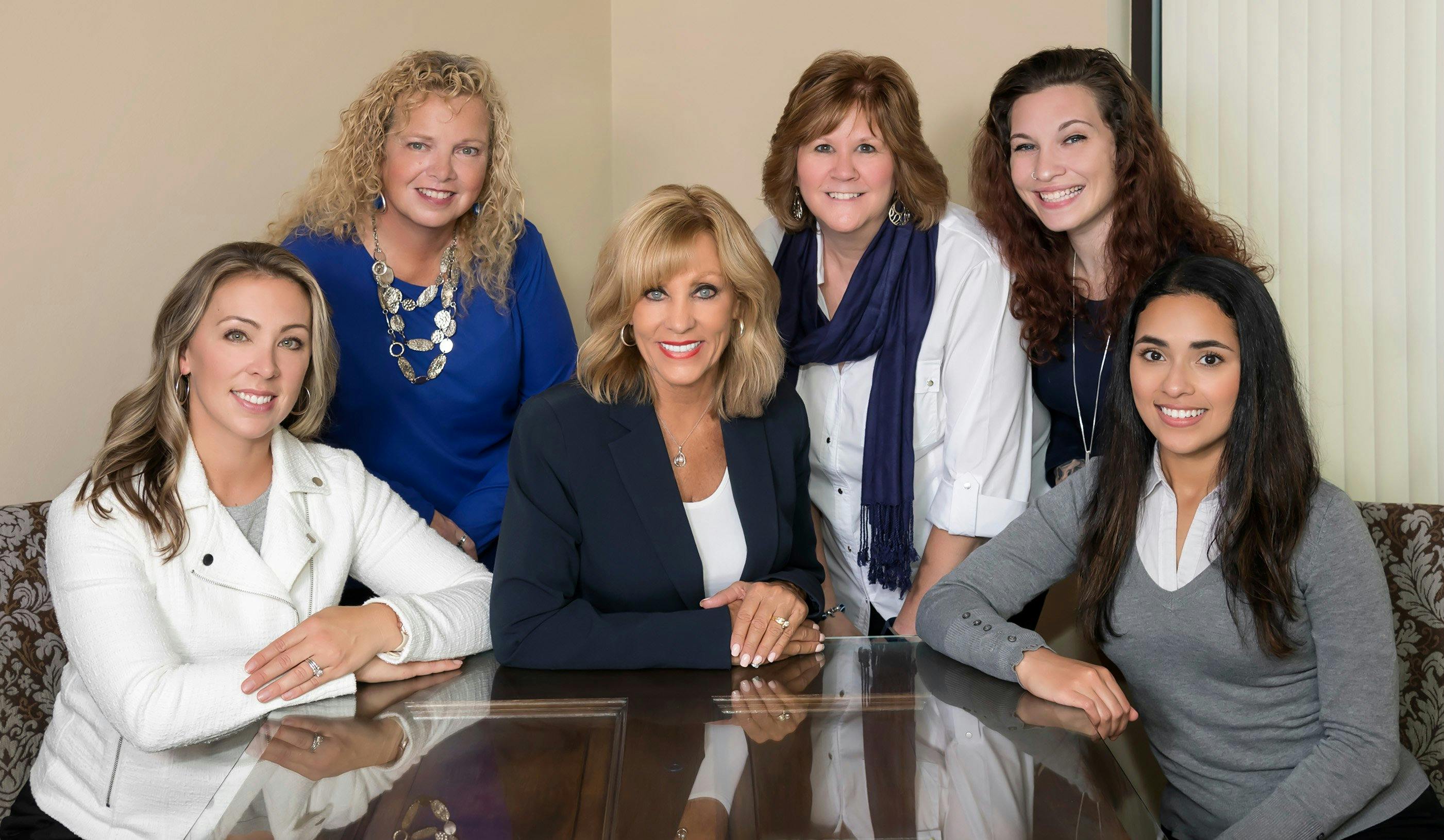 a group of women posing for a photo