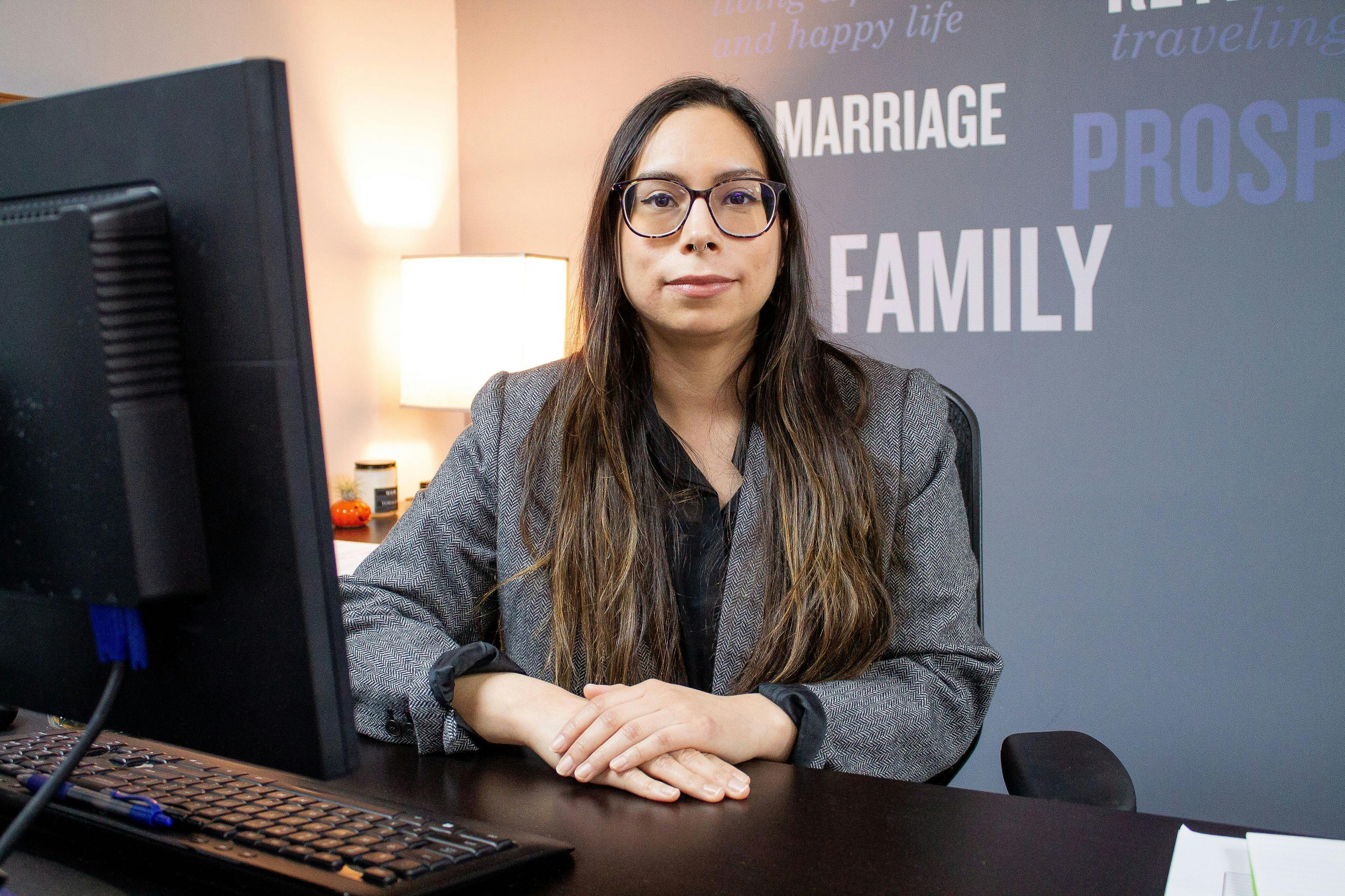 a woman sitting at a desk