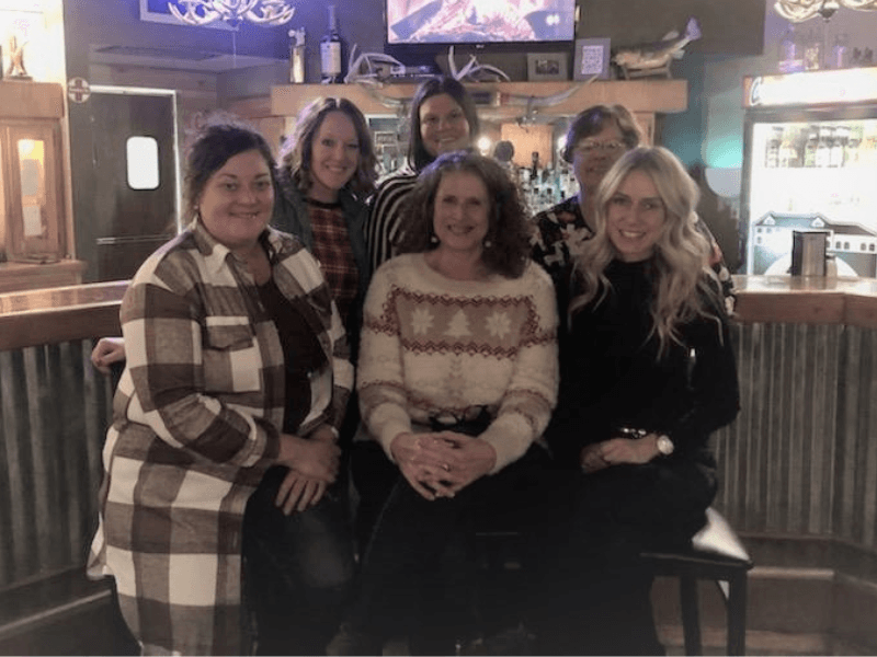 a group of women posing for a photo