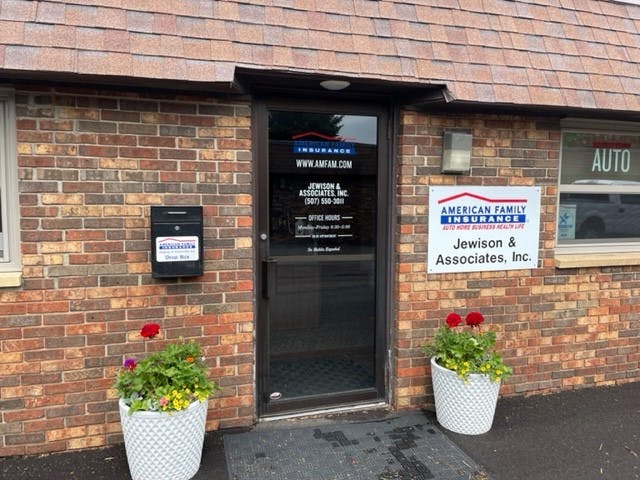 a brick building with a sign on it