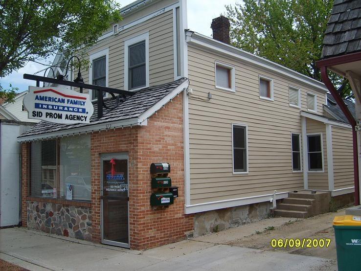 a brick building with a sign on it