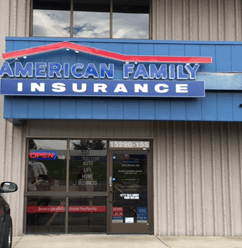 a store front with a blue sign