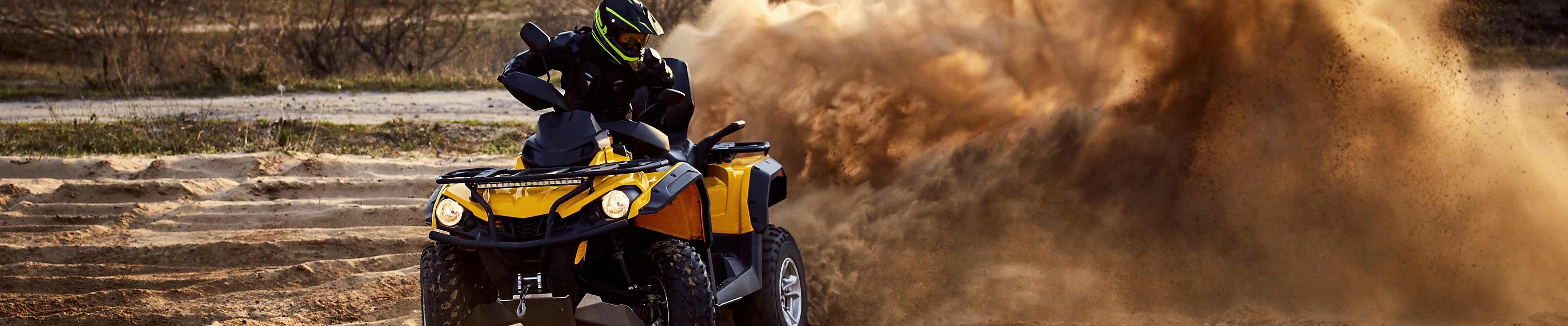 ATV rider wearing safe ATV riding gear.