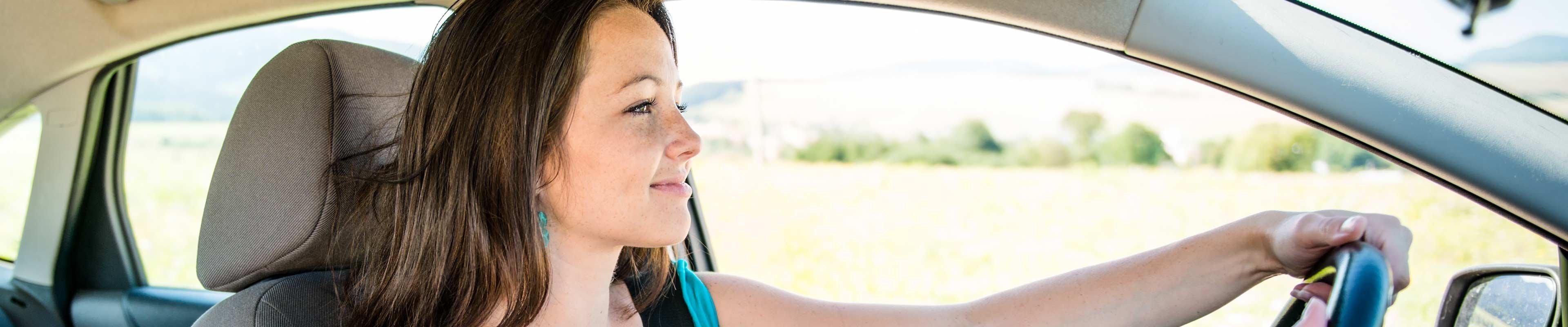 Woman driving a used car