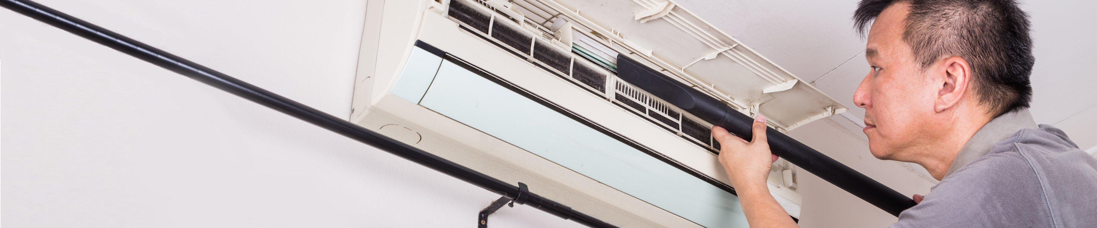 Technician working on a homes air conditioner