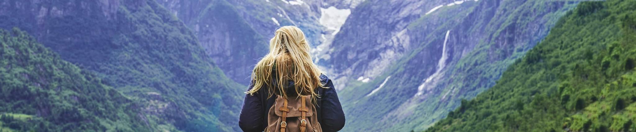 female backpacker looking at a scenic view