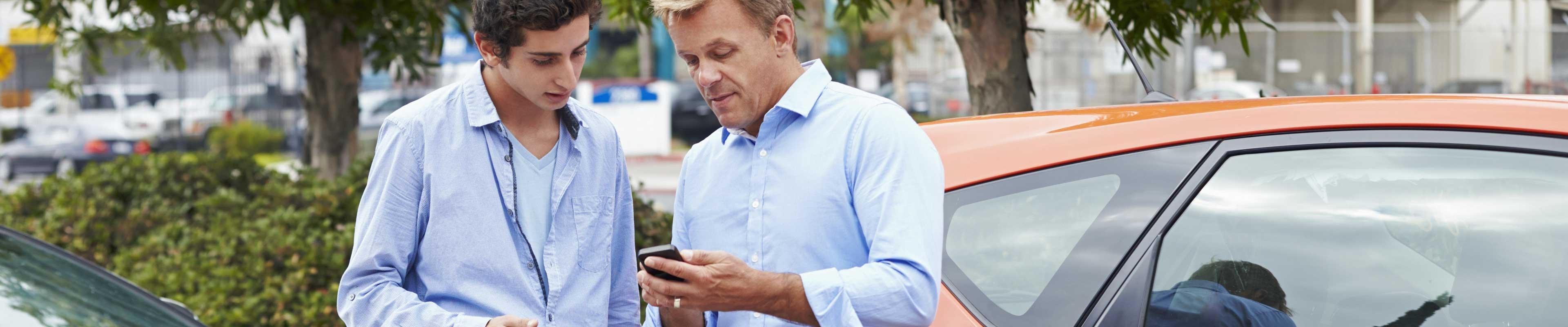 Two drivers discussing collision insurance after accident