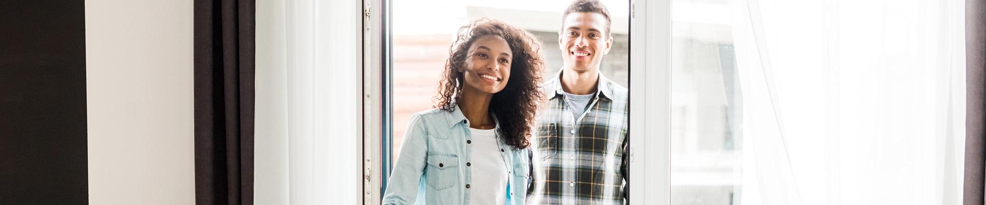 a man and a woman smiling