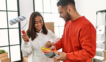 a man and a woman looking at a paper