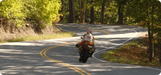 a person riding a motorcycle on a road