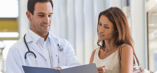 A doctor and a patient going over documents