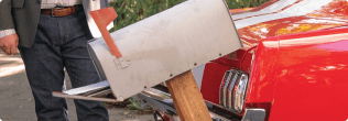 a person holding a large piece of wood