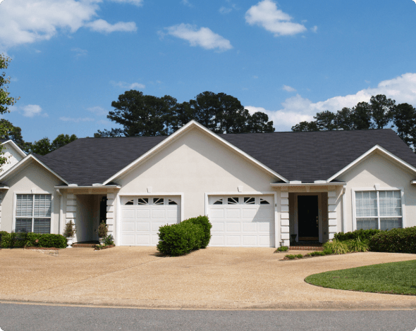 A street-view of a new duplex on a sunny day. 