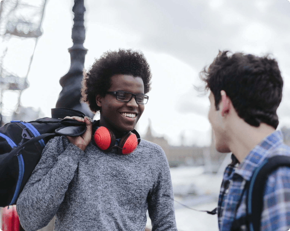 two men talking outside