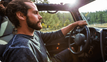 a man driving a car